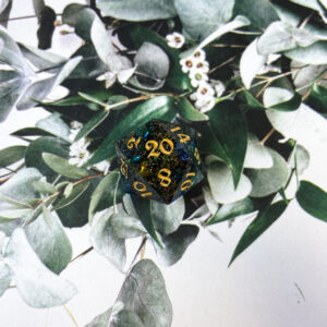 This beautiful glaxy-inspired D20 is mixed with blue, gold, and black mica with sprinkles of gold glitter and blue mylar. Finished with gold ink and shiny polish!