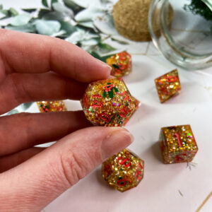 This D20 has the most incredible sparkle and shine! Filled with gold and pink glitter mixed with cacti and finished with pink numbering. Perfect for a desert campaign or plant lover!